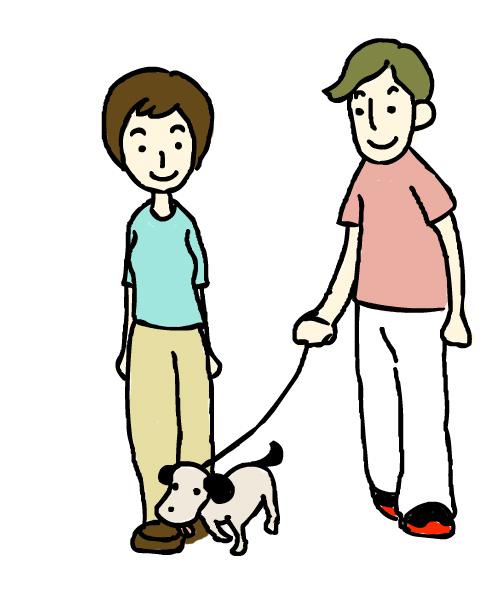 犬の散歩をする男女